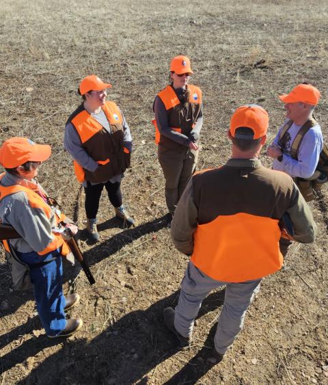 Students getting firearm safety instruction in the field