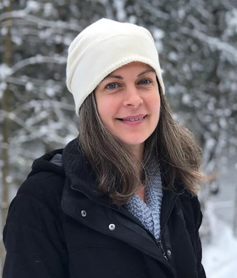Meghan Gilbart standing in snowy woods