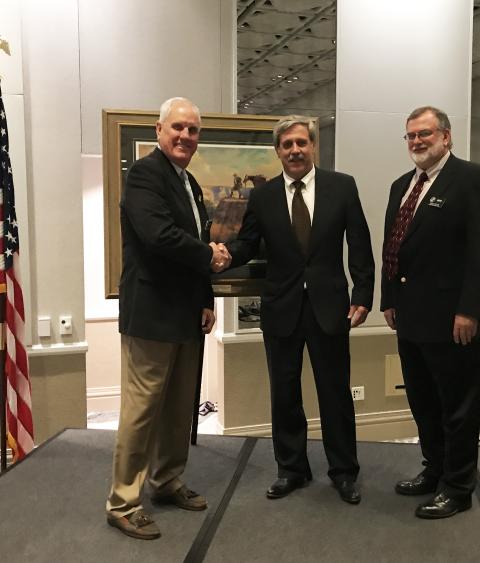 Boone &amp; Crockett Club president Ben Hollingsworth Jr. (L) and stewardship and multiple-use sharing committee co-chair Jimmy Bullock (R) present the Conservation and Stewardship Award to Steve Williams.