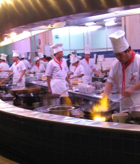 Kitchen crowded with cooks