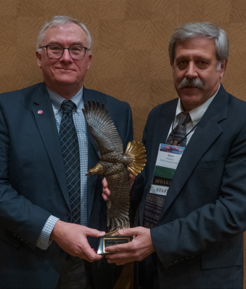 Daniel Decker receiving George Bird Grinnell award from Steve Williams