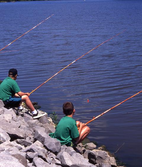 A trio of anglers on the riverbank