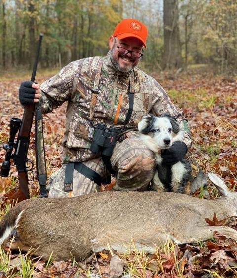 Leo Miranda-Castro with his hunting dog and deer harvest