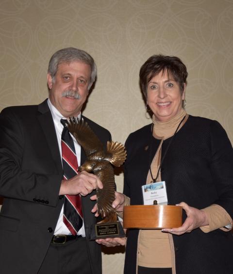 Rebecca Humphries receiving the Grinnell Award from Steve Williams