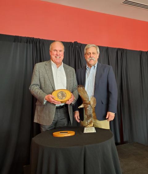 Steve Williams presents Grinnell Award to Charles Wooley