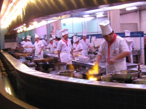 Kitchen crowded with cooks