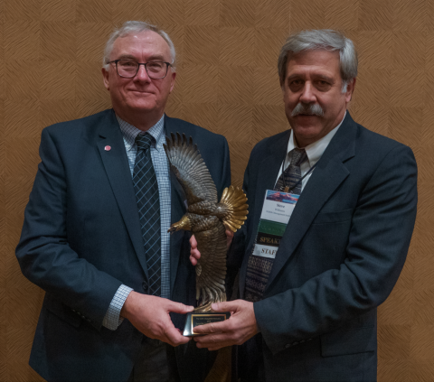 Daniel Decker receiving George Bird Grinnell award from Steve Williams