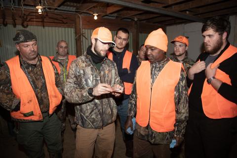 A hunter education instructor teaches class.