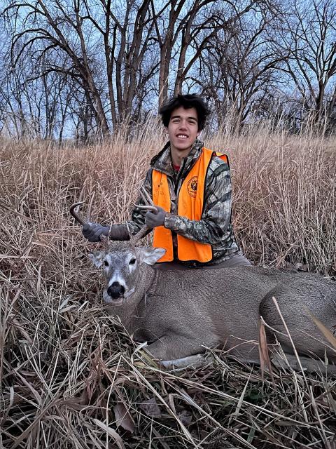 Tyler posed with his first buck